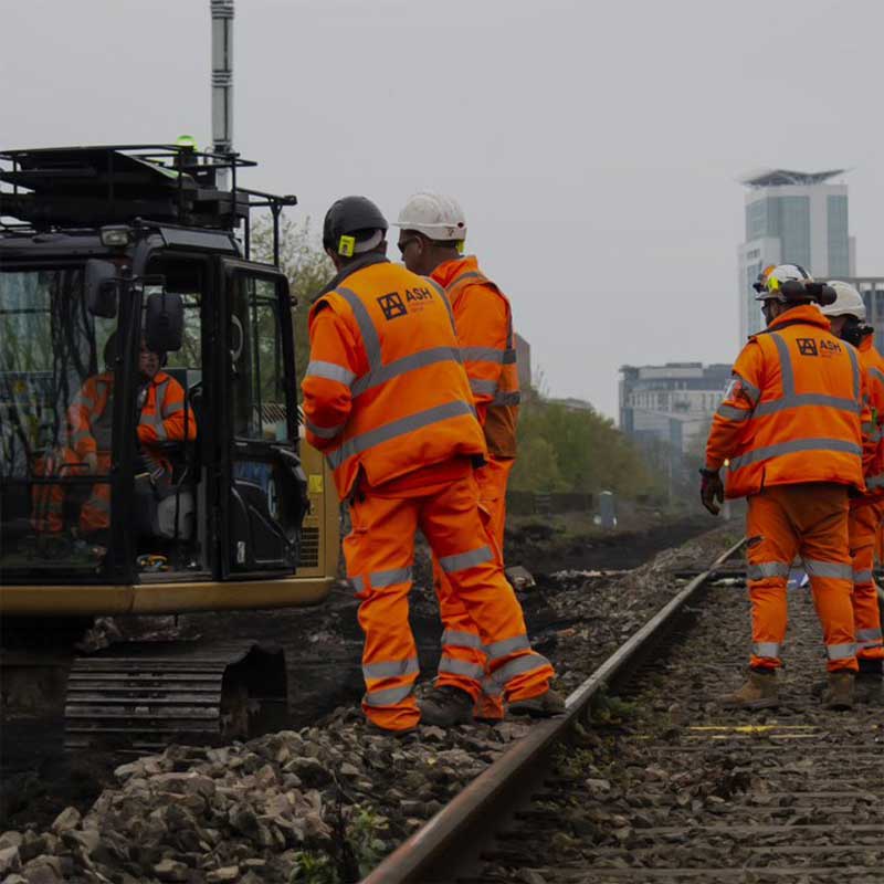 Image of ASH CG workers on rail tracks